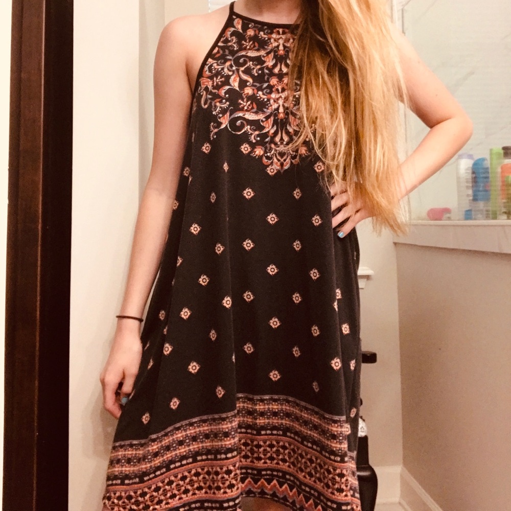 A black Roxy dress with a pink pattern design